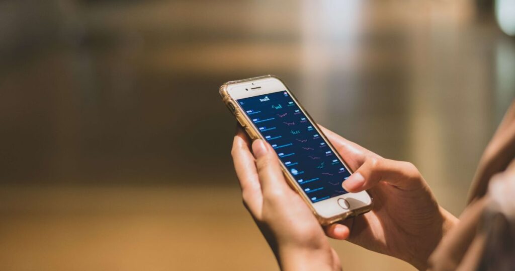 Hands holding a smartphone with the screen in focus