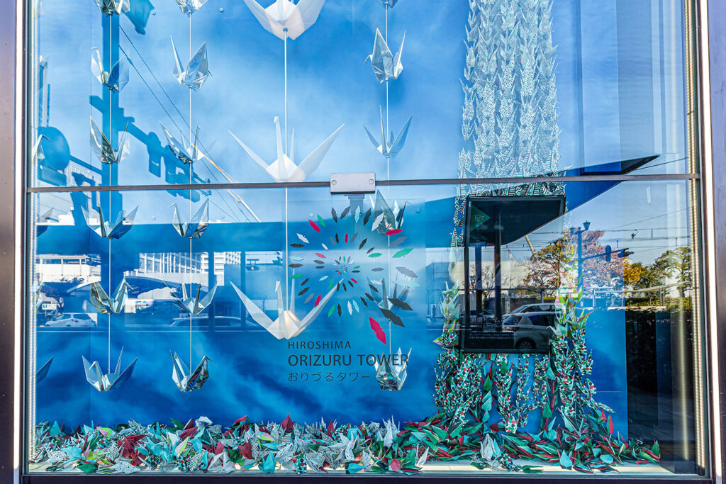 Orizuru Tower experience in Hiroshima, folding and placing origami cranes